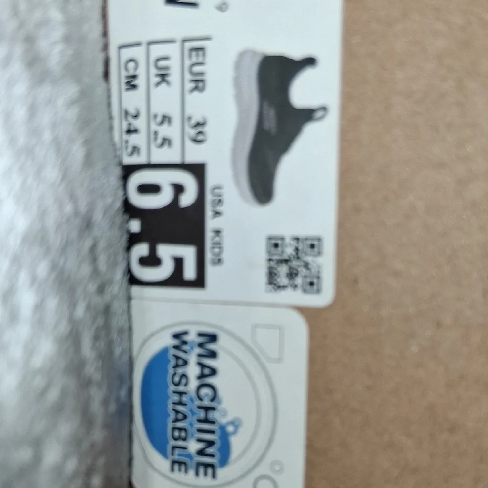 Skechers Boy’s Black and White Slip-On Athletic Sneakers